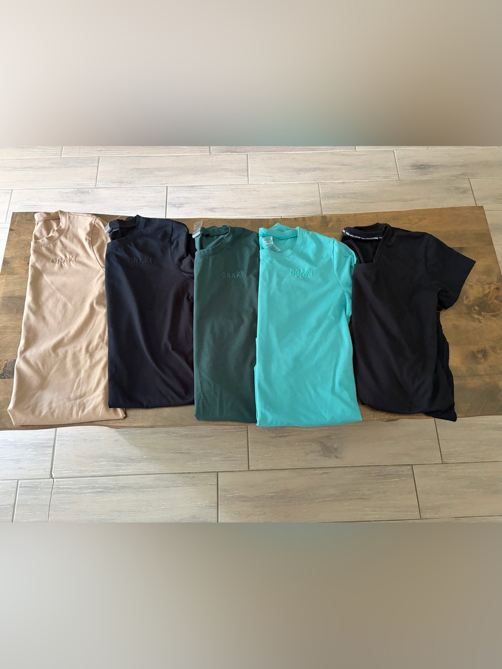 Oraki Women’s Tunic Top - Teal with Embossed Logo
